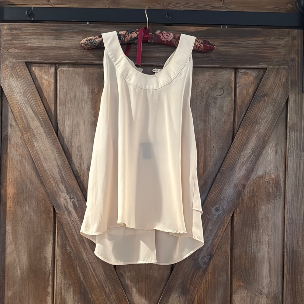 Elegant Cream Sleeveless Blouse with rhinestone back